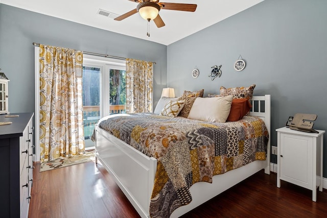 bedroom with dark wood-type flooring and ceiling fan