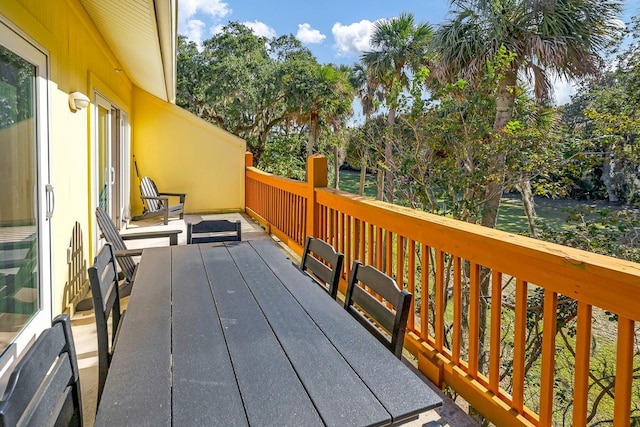 wooden terrace featuring a water view