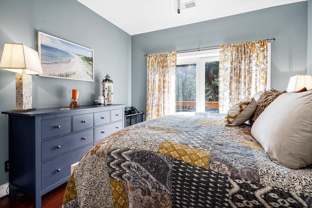 bedroom featuring a baseboard radiator and dark hardwood / wood-style flooring