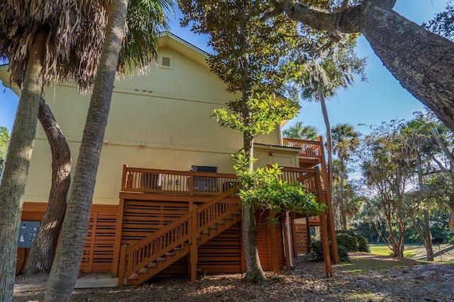 back of property with a wooden deck