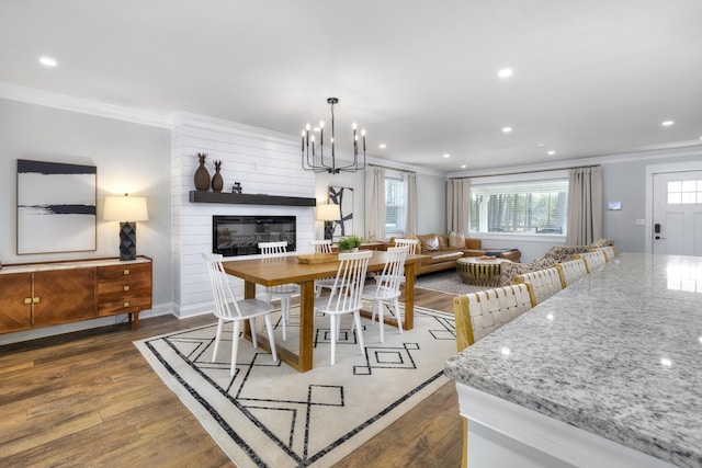 1762 James Loop Rd, Manning, SC 29102 - dining area featuring ornamental molding, wood finished floors, a chandelier, a large fireplace, and recessed lighting