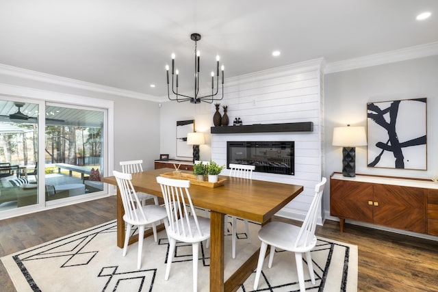 1762 James Loop Rd, Manning, SC 29102 - dining room with wood finished floors, a large fireplace, ornamental molding, a chandelier, and recessed lighting