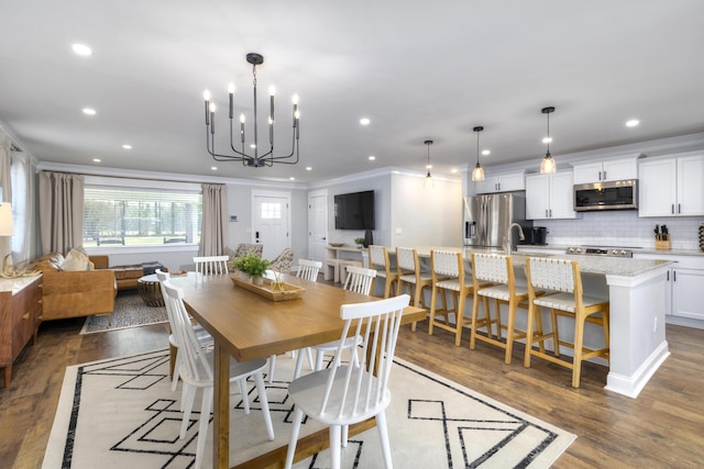 1762 James Loop Rd, Manning, SC 29102 - dining room with wood finished floors, ornamental molding, recessed lighting, and a chandelier
