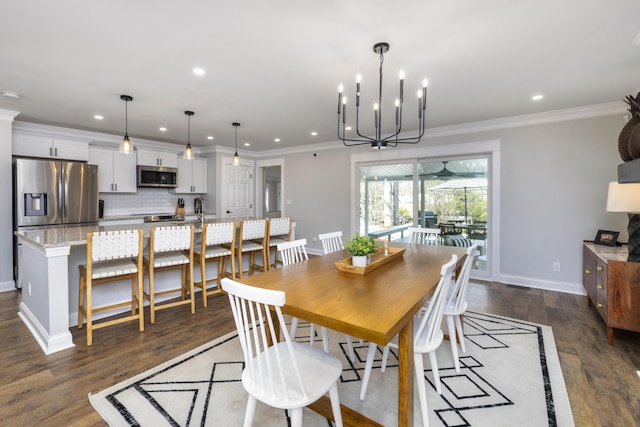 1762 James Loop Rd, Manning, SC 29102 - dining room with recessed lighting, dark wood-style flooring, ornamental molding, baseboards, and a chandelier