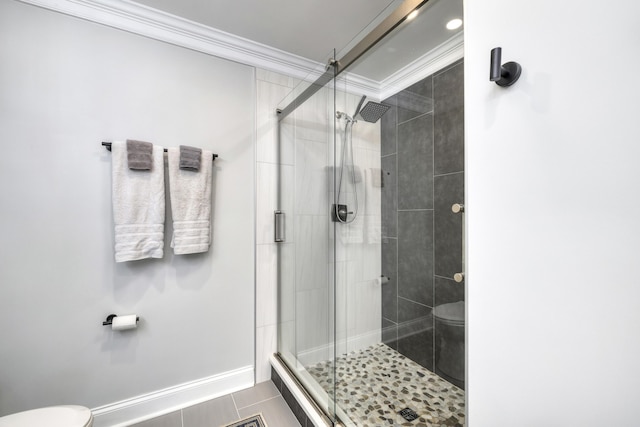 1762 James Loop Rd, Manning, SC 29102 - full bathroom featuring toilet, ornamental molding, a shower stall, tile patterned floors, and baseboards