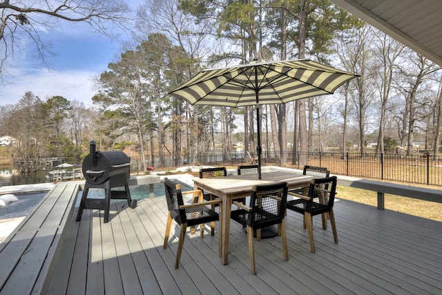 1762 James Loop Rd, Manning, SC 29102 - deck with a fenced backyard, outdoor dining space, view of scattered trees, and grilling area