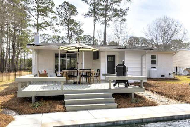 1762 James Loop Rd, Manning, SC 29102 - rear view of property with brick siding, a chimney, a deck, and outdoor dining area