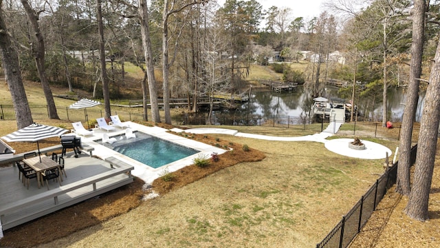 1762 James Loop Rd, Manning, SC 29102 - view of swimming pool featuring a deck with water view, view of wooded area, and outdoor dining space