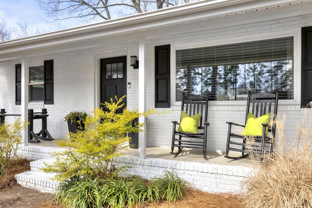 1762 James Loop Rd, Manning, SC 29102 - doorway to property with covered porch and brick siding