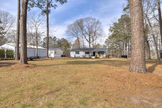 1762 James Loop Rd, Manning, SC 29102 - view of front of house featuring a front lawn and a porch
