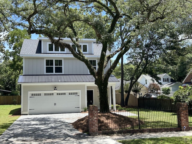 641 Magnolia Rd, Charleston, SC 29407 - view of front of home featuring a standing seam roof, driveway, an attached garage, a metal roof, and a shingled roof