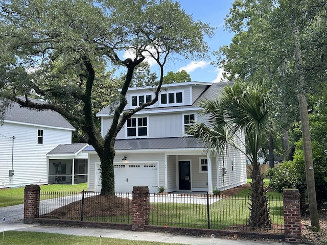 641 Magnolia Rd, Charleston, SC 29407 - view of front of property with a sunroom, a fenced front yard, driveway, a garage, and a metal roof