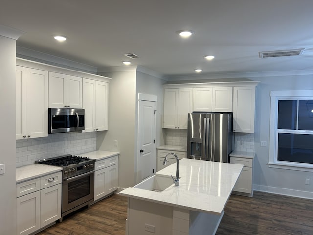 641 Magnolia Rd, Charleston, SC 29407 - kitchen with appliances with stainless steel finishes, ornamental molding, tasteful backsplash, dark wood-type flooring, and light stone countertops