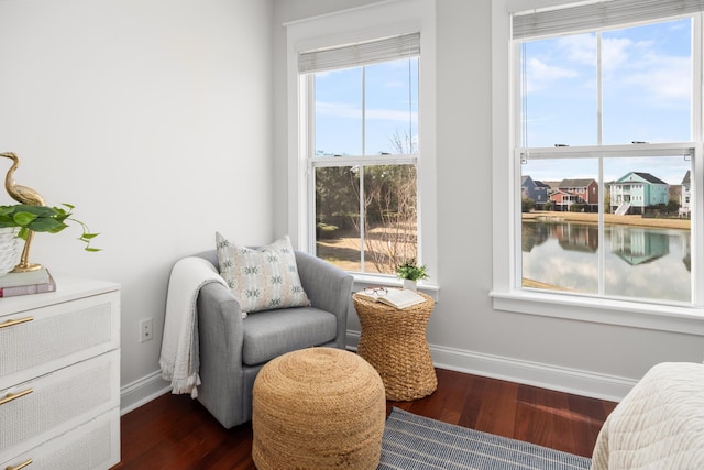 sitting room featuring dark wood finished floors and baseboards