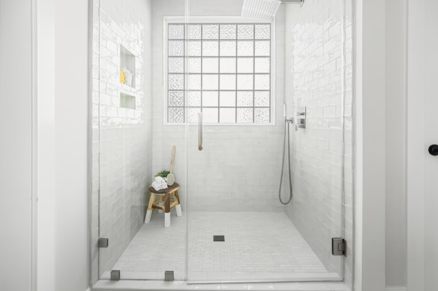 full bath with a shower stall