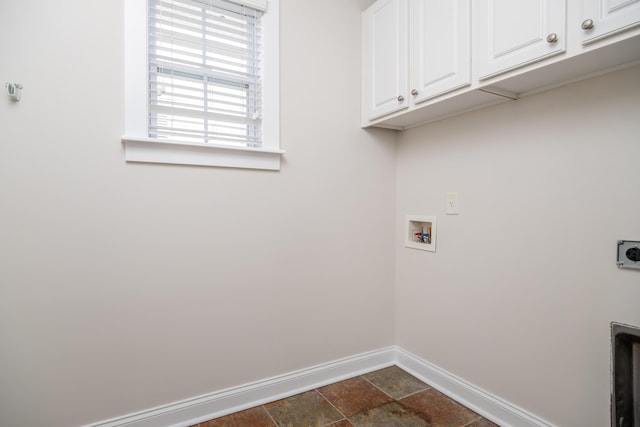 clothes washing area with hookup for a washing machine, cabinet space, baseboards, and electric dryer hookup