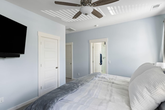 bedroom with ceiling fan and baseboards