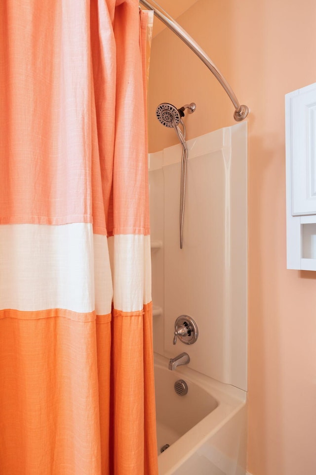 bathroom with shower / tub combo