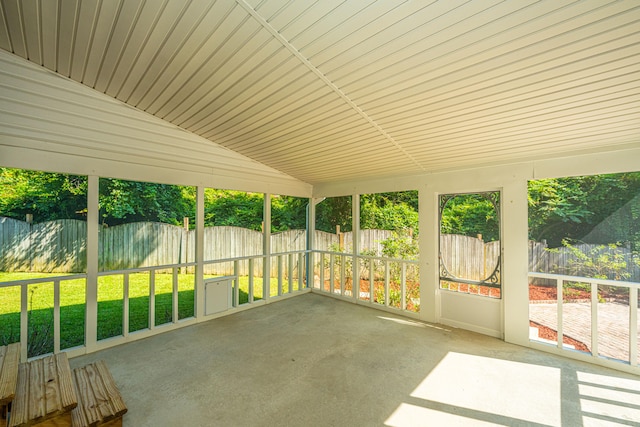 unfurnished sunroom with vaulted ceiling and plenty of natural light