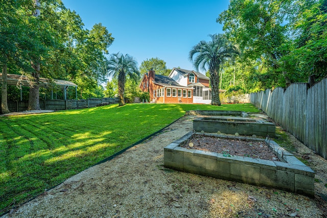 view of yard featuring a sunroom