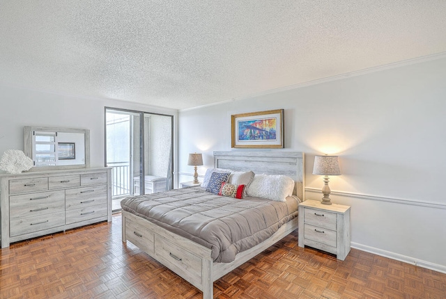 bedroom featuring a textured ceiling and dark parquet floors