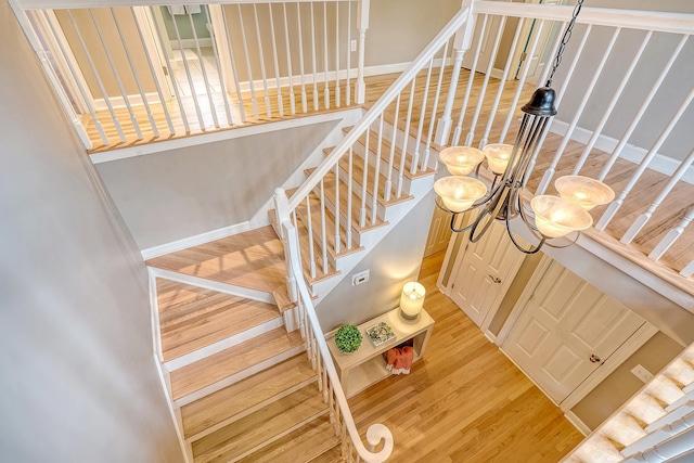 stairway featuring wood finished floors