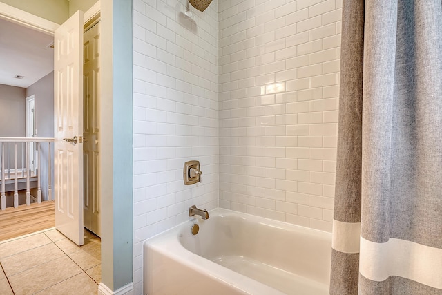 full bathroom featuring tile patterned flooring and shower / tub combination