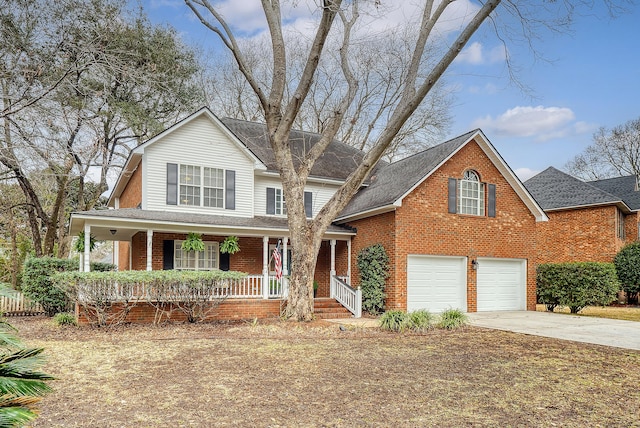 view of front facade featuring driveway, roof with shingles, brick siding, a garage, and a porch