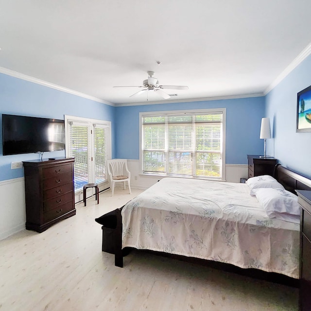 bedroom with multiple windows, ceiling fan, light hardwood / wood-style floors, and ornamental molding