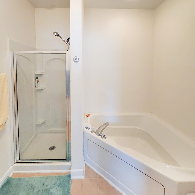 bathroom with tile patterned flooring and plus walk in shower