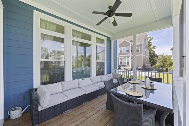 sunroom featuring ceiling fan