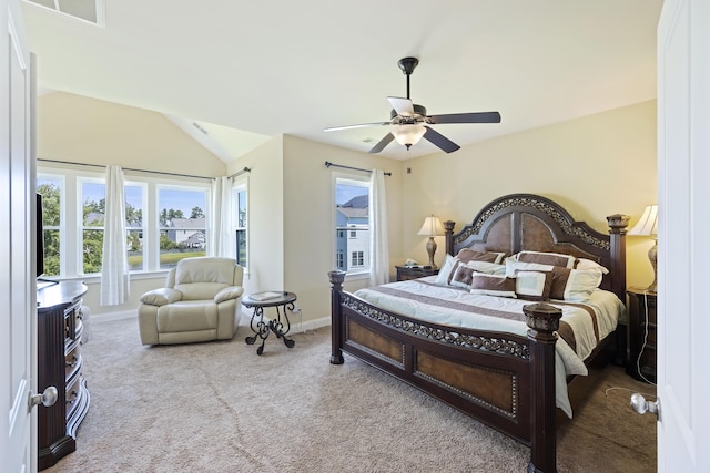 carpeted bedroom featuring ceiling fan and lofted ceiling