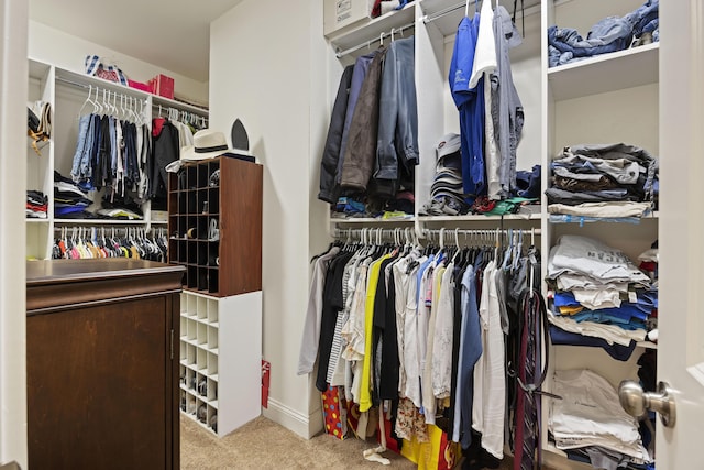 walk in closet featuring carpet