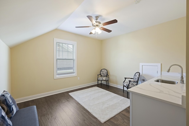 office area with ceiling fan, vaulted ceiling, dark hardwood / wood-style flooring, and sink