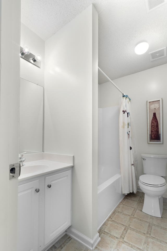 full bathroom with vanity, toilet, a textured ceiling, and shower / bath combo