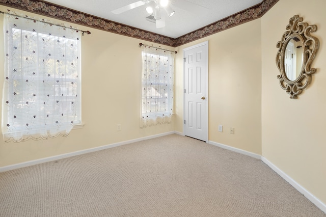 empty room with carpet and ceiling fan