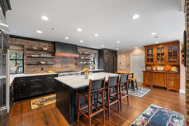 2 Bedons Aly, Charleston, SC 29401 - kitchen featuring dark wood finished floors, ornamental molding, wall chimney exhaust hood, and open shelves