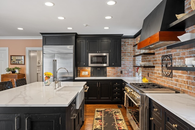 2 Bedons Aly, Charleston, SC 29401 - kitchen with custom range hood, built in appliances, ornamental molding, and dark cabinetry