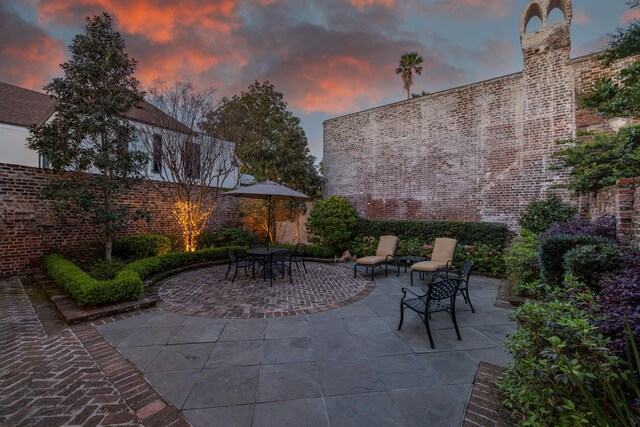 2 Bedons Aly, Charleston, SC 29401 - patio terrace at dusk featuring fence