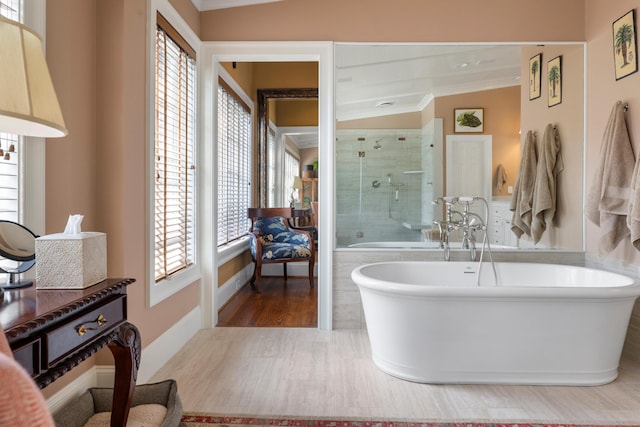 2 Bedons Aly, Charleston, SC 29401 - bathroom featuring a freestanding bath, baseboards, a shower stall, and wood finished floors
