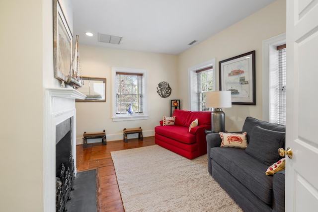 2 Bedons Aly, Charleston, SC 29401 - living room featuring baseboards, recessed lighting, a fireplace with flush hearth, visible vents, and wood finished floors