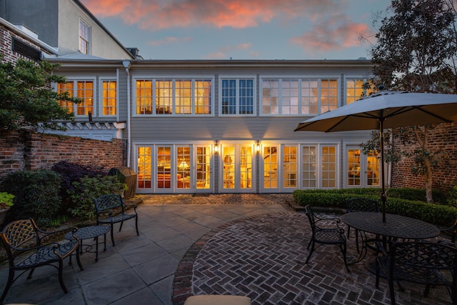 2 Bedons Aly, Charleston, SC 29401 - back of house at dusk with a patio area