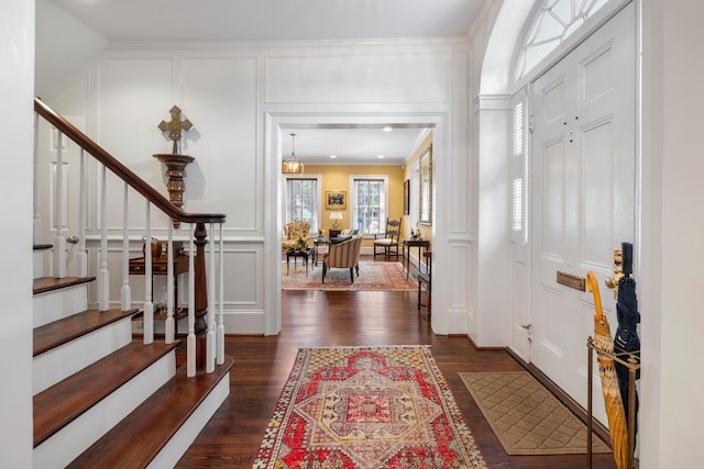 2 Bedons Aly, Charleston, SC 29401 - entryway with dark wood-type flooring, a decorative wall, stairway, and crown molding