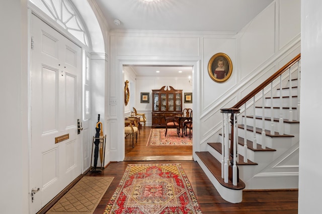 2 Bedons Aly, Charleston, SC 29401 - entryway featuring a decorative wall, crown molding, stairs, and dark wood finished floors