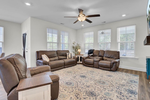 living room with a wealth of natural light, baseboards, dark wood-type flooring, and recessed lighting