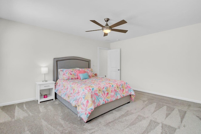 bedroom featuring baseboards, ceiling fan, and carpet flooring