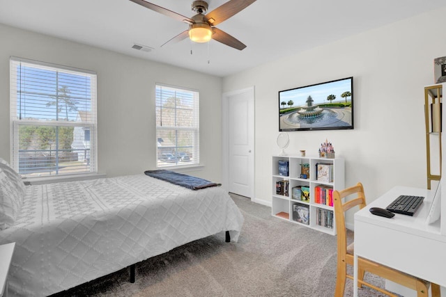 bedroom featuring carpet flooring, a ceiling fan, and visible vents