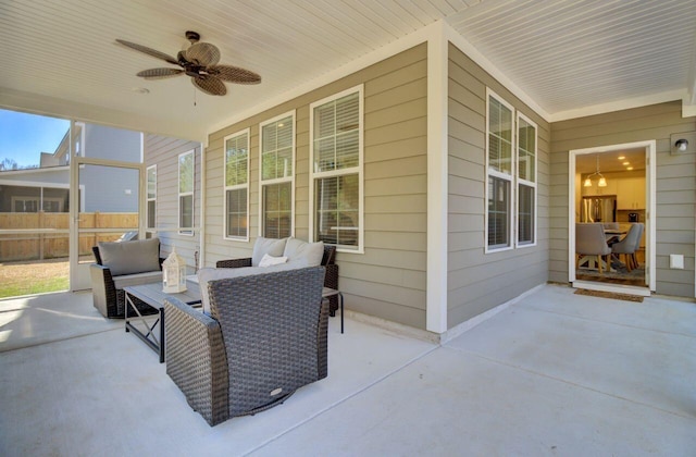 view of patio / terrace with a ceiling fan and fence