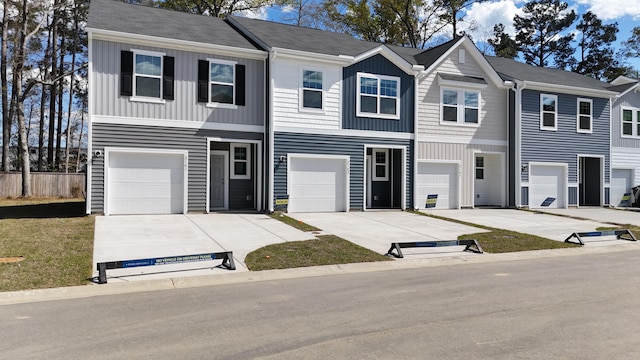 2502 Scarlett Maple St, Summerville, SC 29486 - view of property featuring board and batten siding, concrete driveway, and a garage