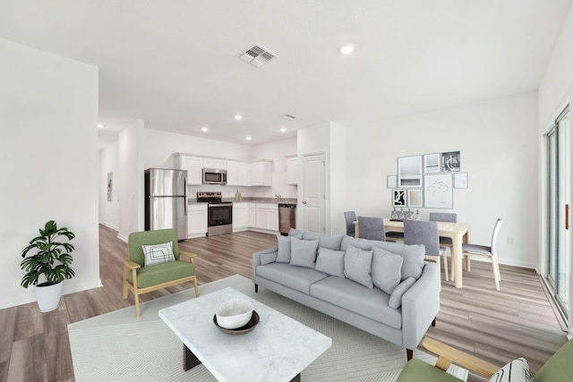2502 Scarlett Maple St, Summerville, SC 29486 - living room with light wood-style flooring and recessed lighting
